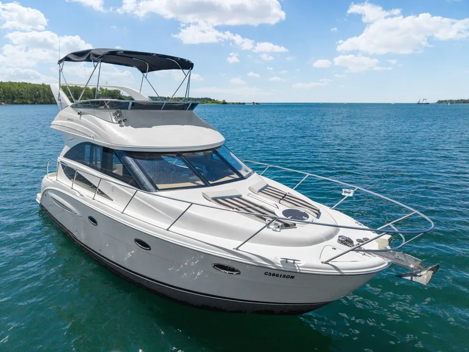 The 36&prime; Double Decker Yacht at rest on flat water.